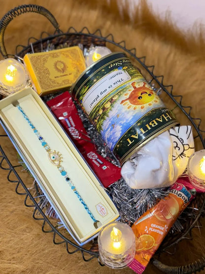 Complete Classic Raksha Bandhan gift hamper featuring one Sun Activated Colour-Changing Kids T-Shirt, Evil Eye Crown Rakhi, chocolates, lollipop, and Roli Chawal set.