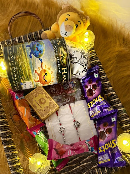 Classic Raksha Bandhan gift hamper beautifully arranged with a Sun Activated Colour-Changing Kids T-Shirt, premium Rakhi, chocolates, and festive accessories.