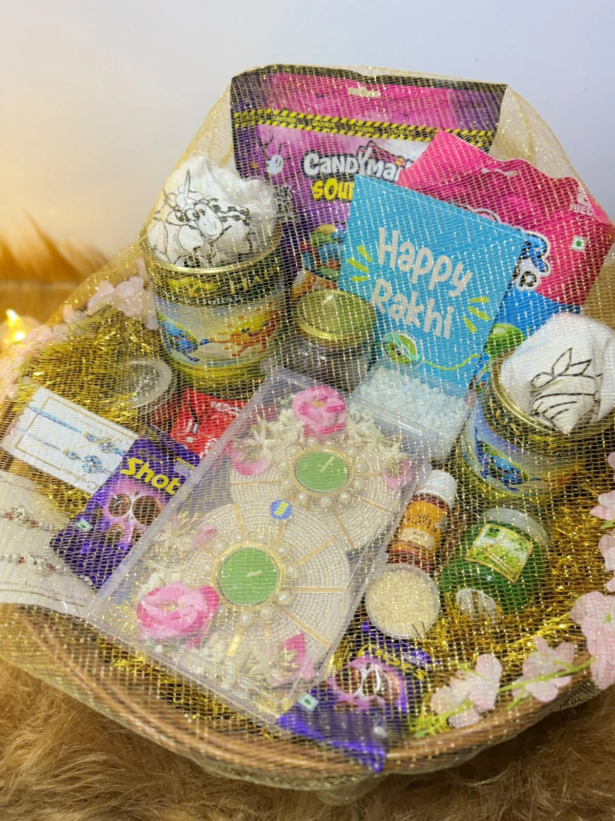 Complete Sun Activated Raksha Bandhan Gift Hamper for Kids with festive essentials, chocolates, Rakhis, and two colour-changing cotton T-Shirts.