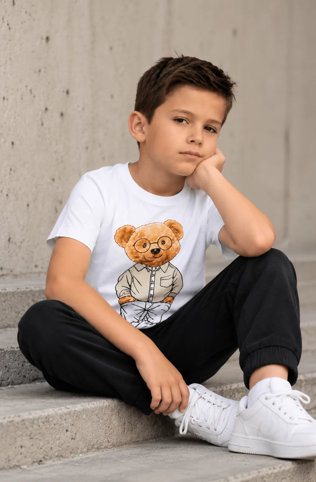 Child wearing Cool Teddy Bear Sun Activated Colour-Changing Kids T-Shirt while sitting outdoors