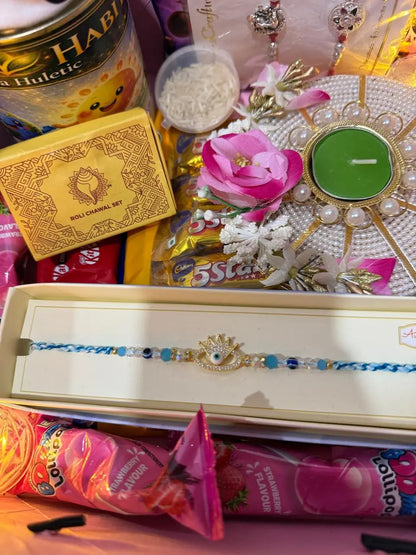 Premium Evil Eye Rakhi included inside the Nysa Huletic Raksha Bandhan gift box.
