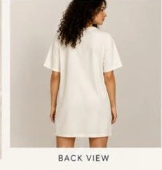 Back view of white knee-length T-shirt dress for women by Nysa Huletic