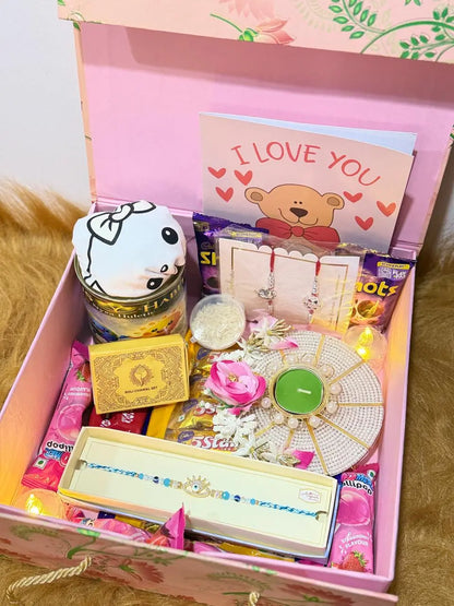 Complete Raksha Bandhan gift box featuring one Sun Activated Colour-Changing T-Shirt, Rakhi, chocolates, greeting card, diya, and festive gifts.