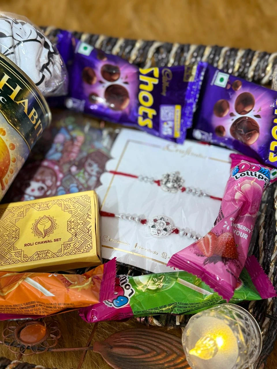 Close-up of the reusable tin containing a Sun Activated Colour-Changing Kids T-Shirt inside the Classic Rakhi Gift Hamper by Nysa Huletic.