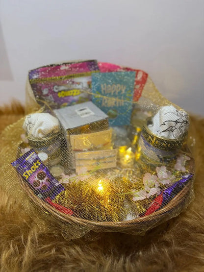 Covered Ultimate Rakhi Celebration Hamper with twin Sun Activated Kids T-Shirts, chocolates, festive decorations, and premium gift packaging.